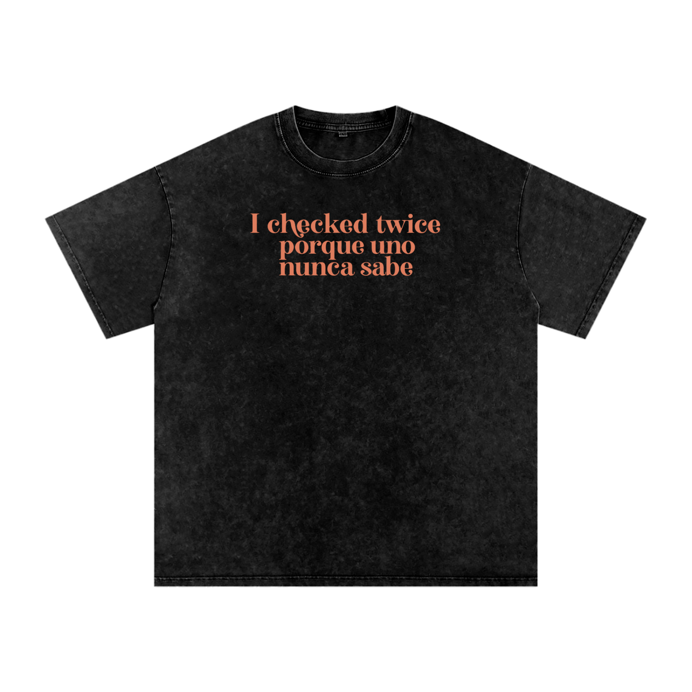 Black acid-washed oversized T-shirt with coral “I checked twice porque uno nunca sabe” text.
