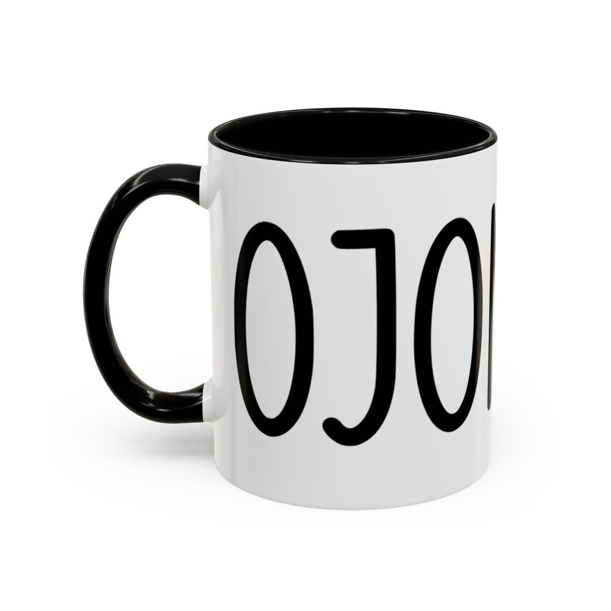 White accent coffee mug with black interior and handle featuring “Cojones” in black lettering on a white background.