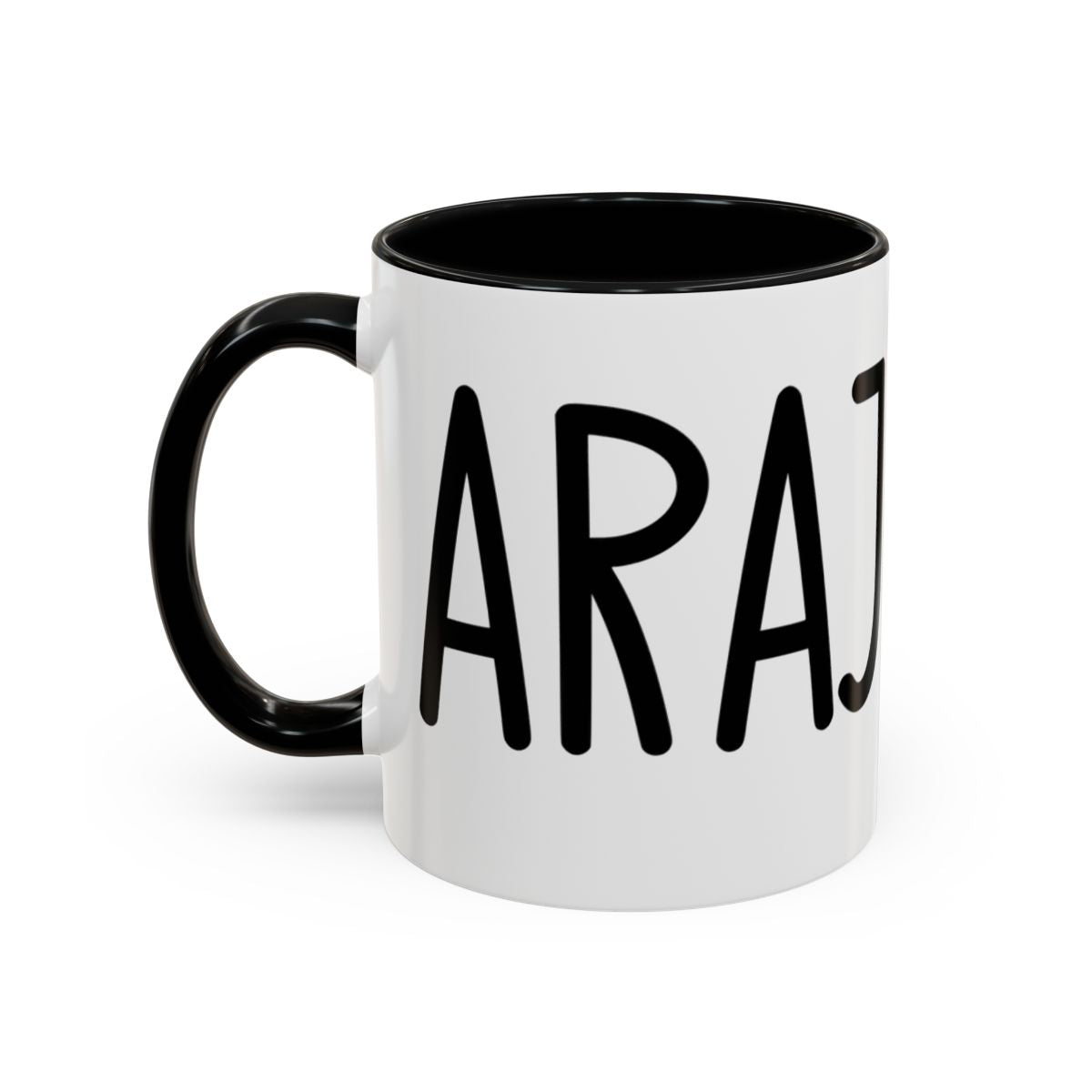 White accent coffee mug with black interior and handle featuring “Carajo” in black lettering on a white background.