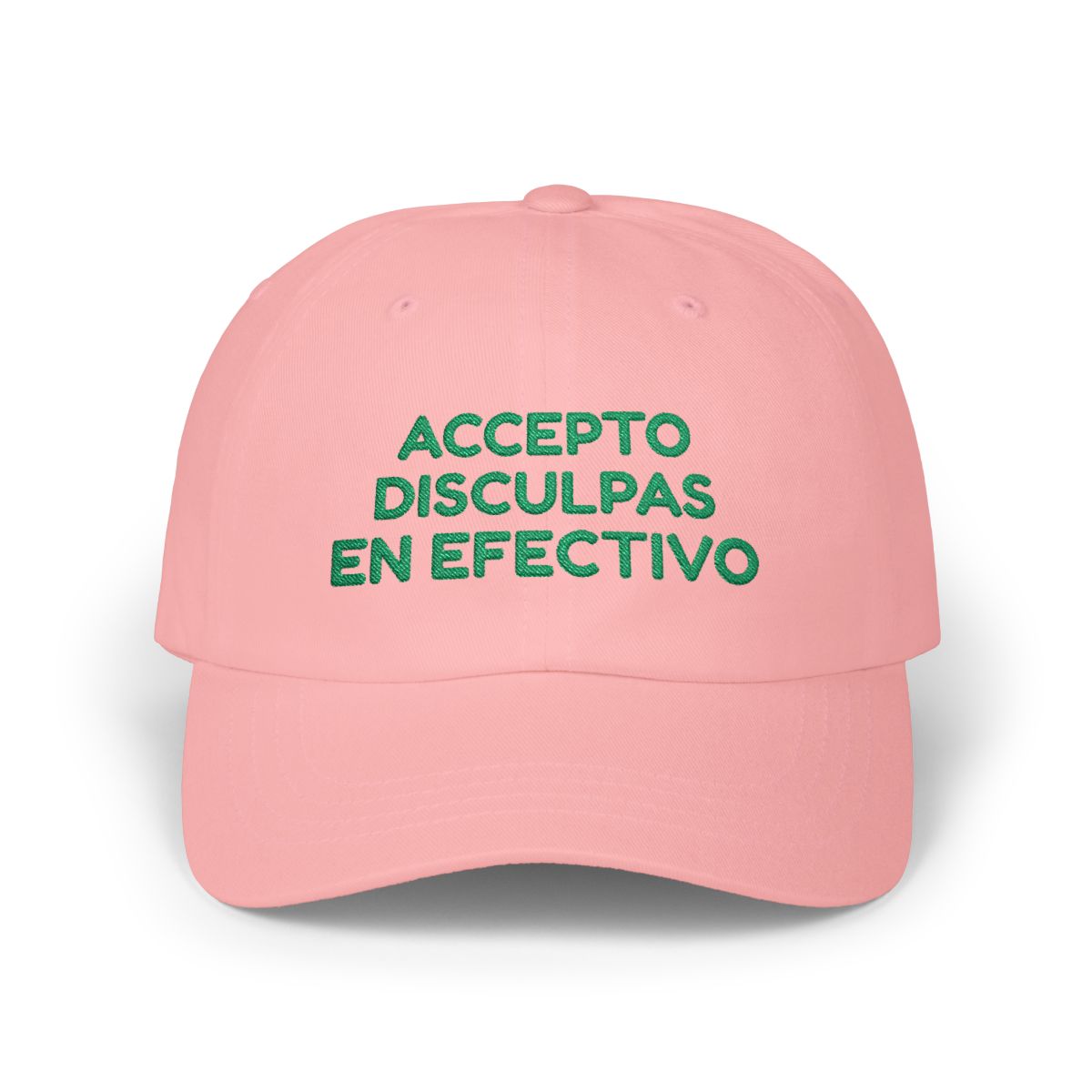 Pink dad cap with green “Accepto disculpas en efectivo” embroidery on a white background.