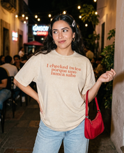 Lifestyle editorial photo — I Checked Twice Porque Uno Nunca Sabe Acid Washed Oversized T-Shirt, Apricot