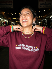Lifestyle editorial photo — Need Money For Pendejadas Embroidered Sweatshirt, Maroon